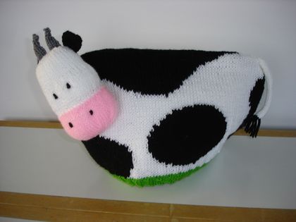 Hand knitted cow tea cosy